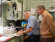 Photo of men in lab. Link to Gifts of Cash, Checks, and Credit Cards