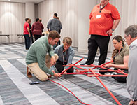 People doing a leadership training activity together. Links to What to Give People doing a leadership training activity together. Links to What to Give